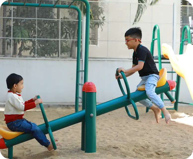 Children playing outside at ILA Montessori.